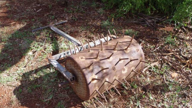 A hand operated lawn aerator